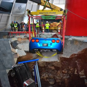 First Corvette Recovered By Crane From Sinkhole At National Corvette Museum